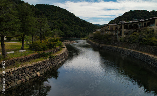 Panoramic view of the Uji river in Japan, in the city of Uji, Kyoto prefecture, Japan.  photo