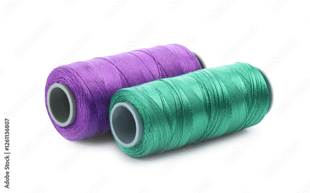 Spools of bright sewing threads isolated on white Spools of bright sewing threads isolated on white