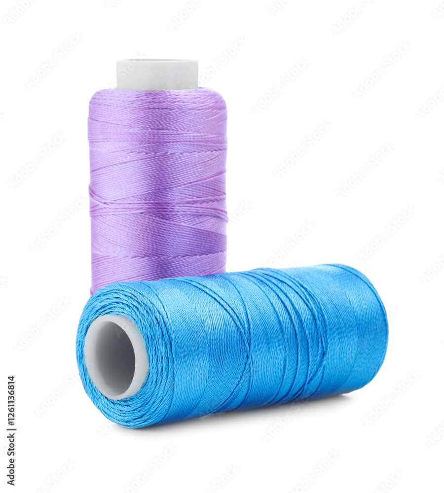 Spools of bright sewing threads isolated on white Spools of bright sewing threads isolated on white