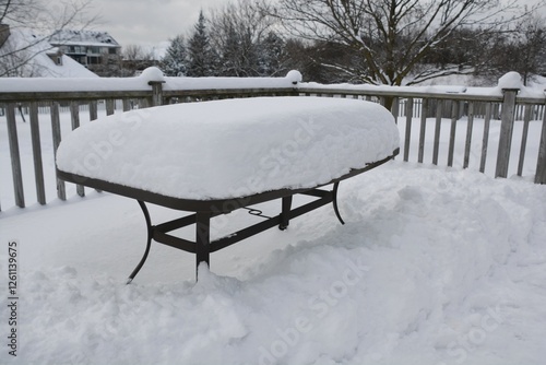 Wallpaper Mural Snow accumulates on an outdoor patio table during a Canadian winter. Torontodigital.ca