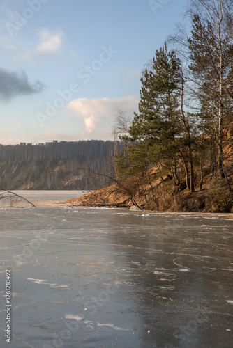 Frozen surface of a reservoir in winter. Ice. photo