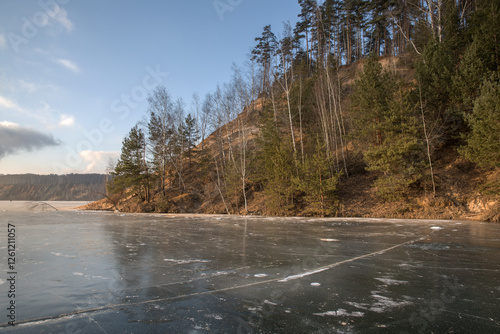 Frozen surface of a reservoir in winter. Ice.