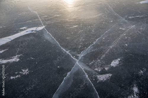 Frozen surface of a reservoir in winter. Ice. photo