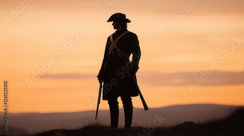 lone Minuteman stands silhouetted against vibrant sunset sky