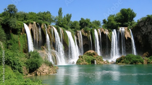 Majestic Waterfall Cascading Over Lush Green Cliffs