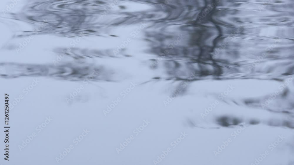Abstract reflection on rippling water, creating mesmerizing patterns. Abstract reflection on rippling water, creating mesmerizing patterns.