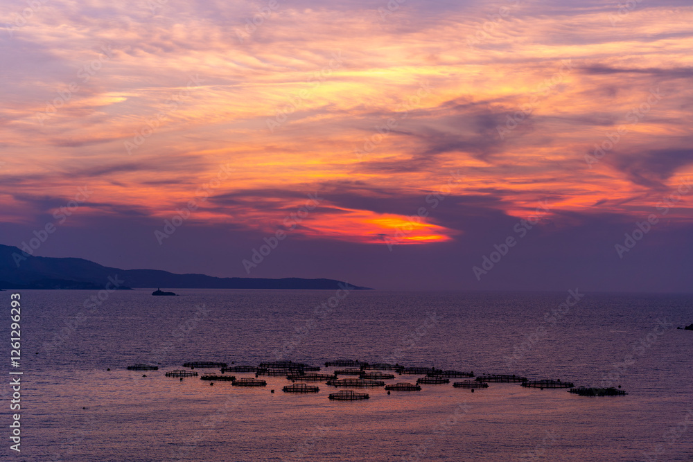 Obraz premium Albania, Vlorë County, Ksamil - 17 August 2024 - Fantastic sunset in Ksamil with the sky with intense colors