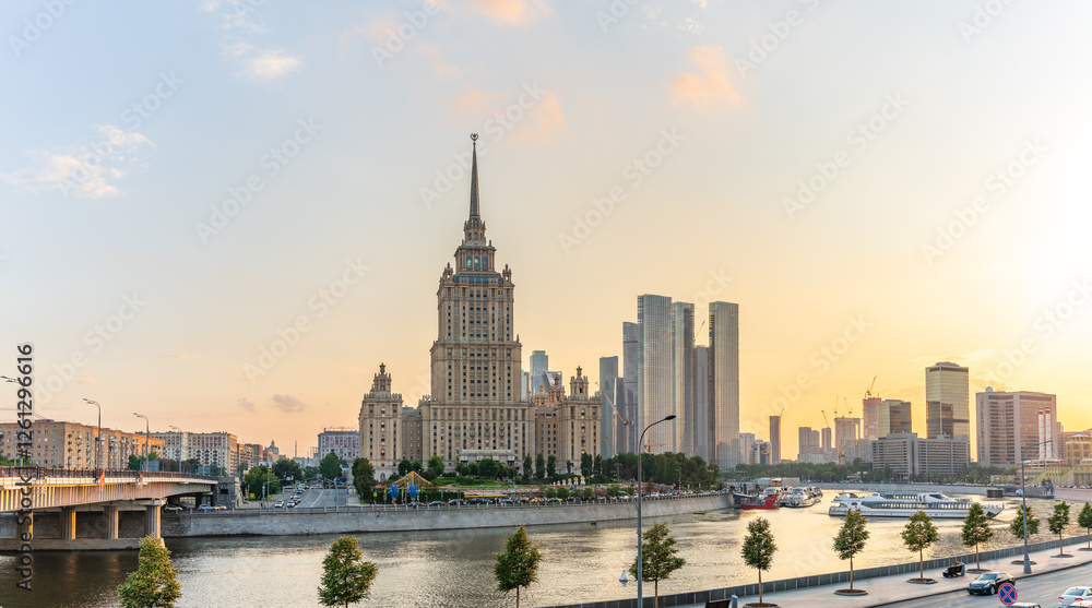 Obraz premium High-rise stalinist building near river at summer sunset in Moscow, Russia. Historic name is Hotel Ukraine.