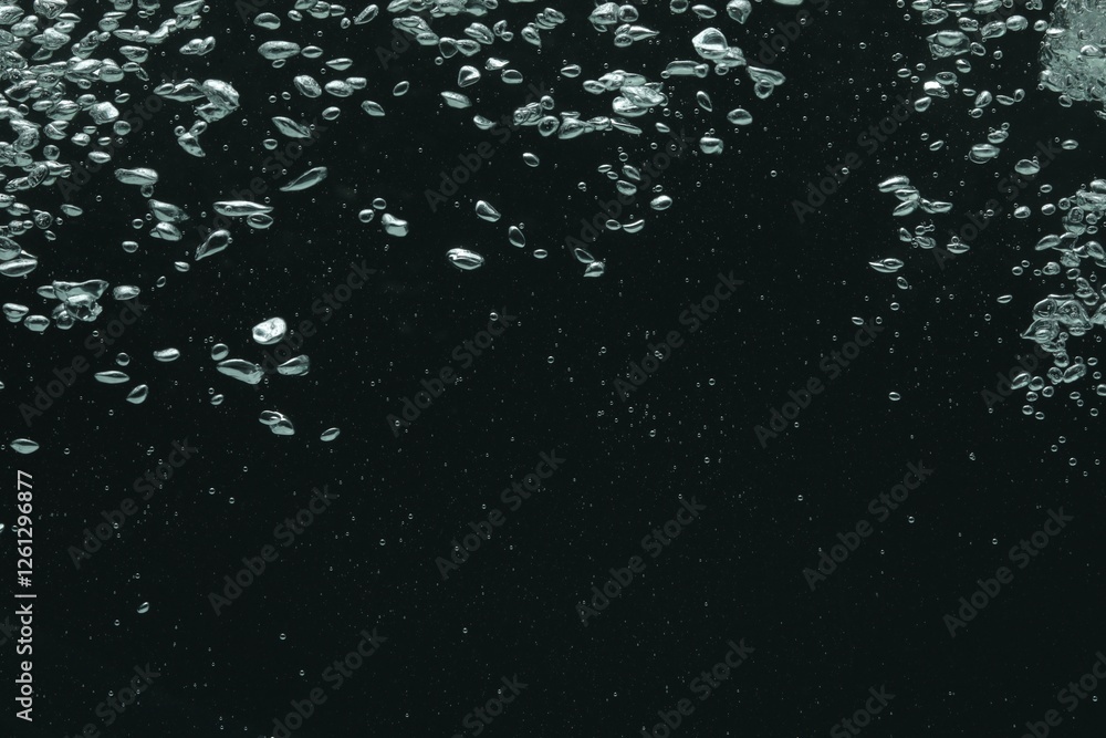 Obraz premium Many water bubbles on black background, closeup