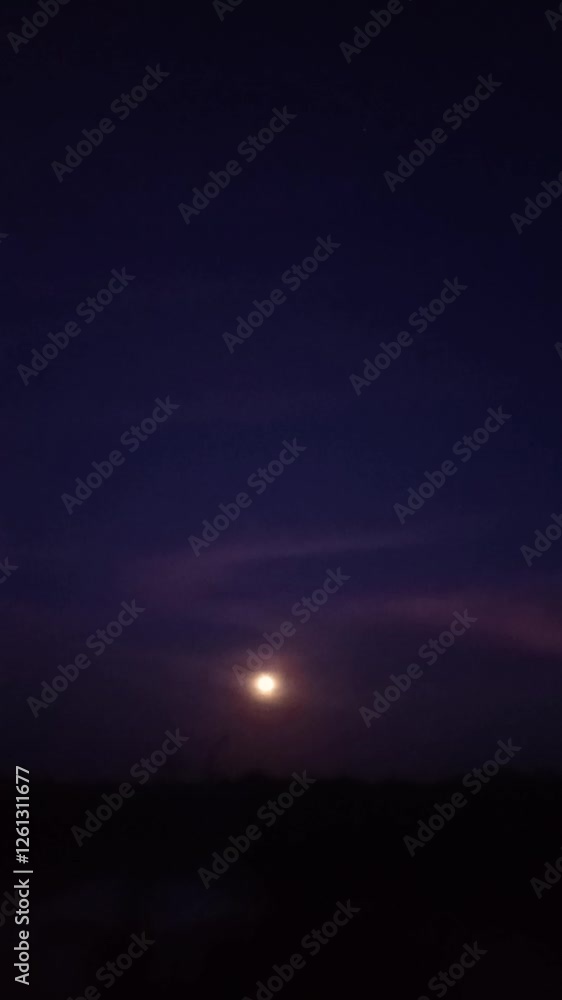 Full Moon Glowing in a Dark Twilight Sky with Subtle Purple and Blue Hues Creating a Mystical Night Scene Full Moon Glowing in a Dark Twilight Sky with Subtle Purple and Blue Hues Creating a Mystical Night Scene