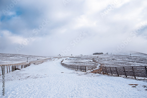 Landscape photography of skiing trail and fencing, funicular, cold weather, snowy path, ski resort, Aviemore, Cairngorms, Scotland, UK