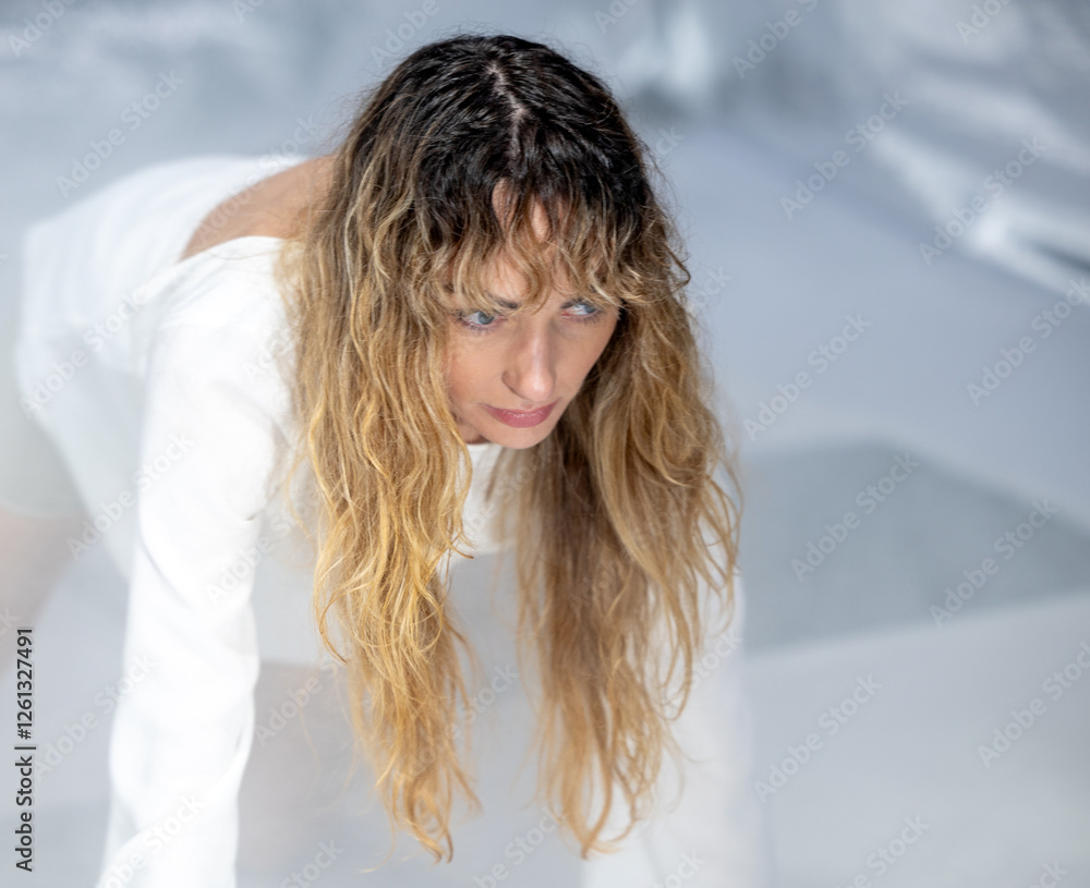 Dance, Painting, and Creative Expression – A Young Beautiful Woman Posing in a Photo Studio Dance, Painting, and Creative Expression – A Young Beautiful Woman Posing in a Photo Studio