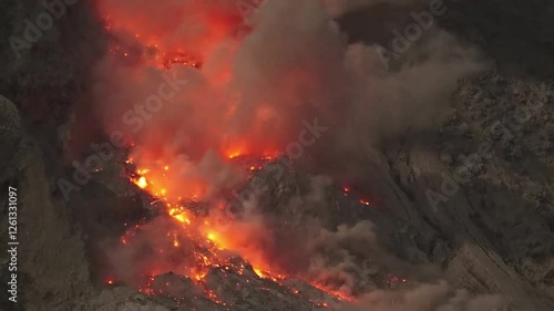 Glowing rockfall of hot lava cascading down the flank of Mount Sinabung volcano, Indonesia.
