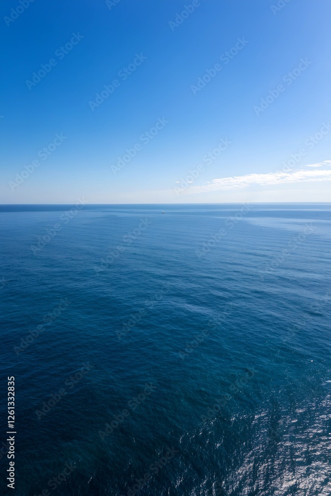 Endless Calm Ocean Under Clear Blue Sky, Tranquil Horizon with Soft Gradients and Perfect Peaceful Reflection. Endless Calm Ocean Under Clear Blue Sky, Tranquil Horizon with Soft Gradients and Perfect Peaceful Reflection.
