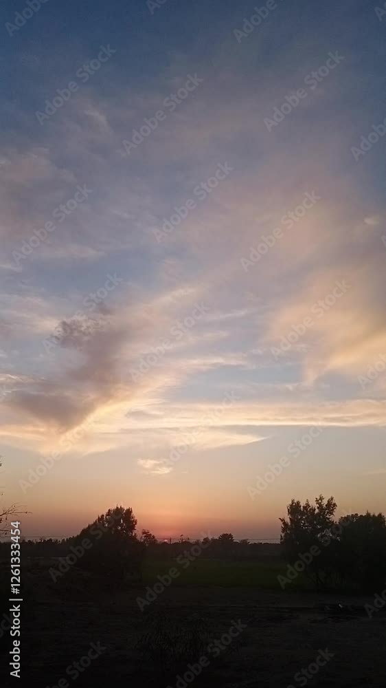 Serene Countryside Sunset with Golden Clouds and a Soft Pastel Sky at Dusk Serene Countryside Sunset with Golden Clouds and a Soft Pastel Sky at Dusk