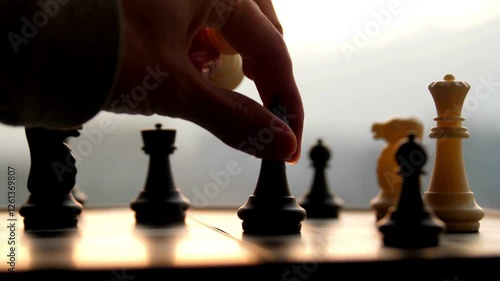 hand moving chess killing king piece board background competition success success Business Strategy.
