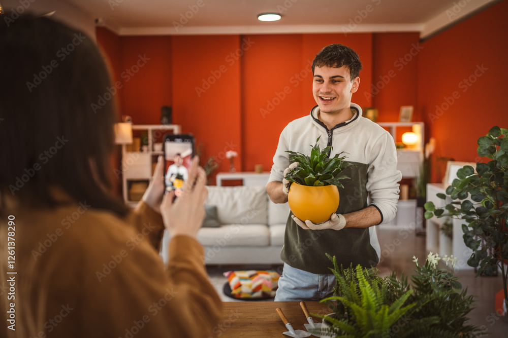 man gardner give an interview for a video blogger while woman filming man gardner give an interview for a video blogger while woman filming
