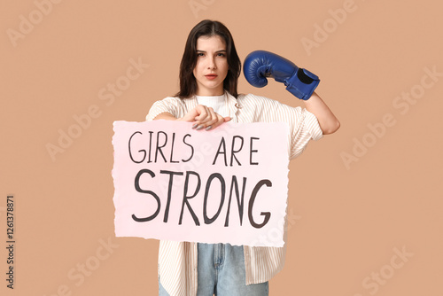 Young woman with sign GIRLS...