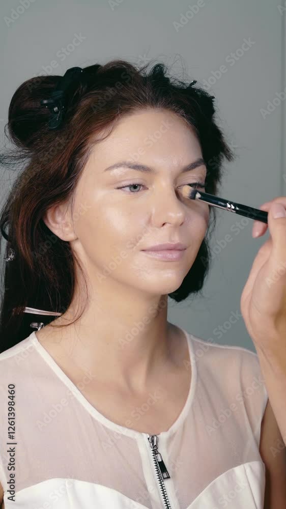 Makeup Application in a Studio Setting Featuring a Model for Professional Photography Makeup Application in a Studio Setting Featuring a Model for Professional Photography