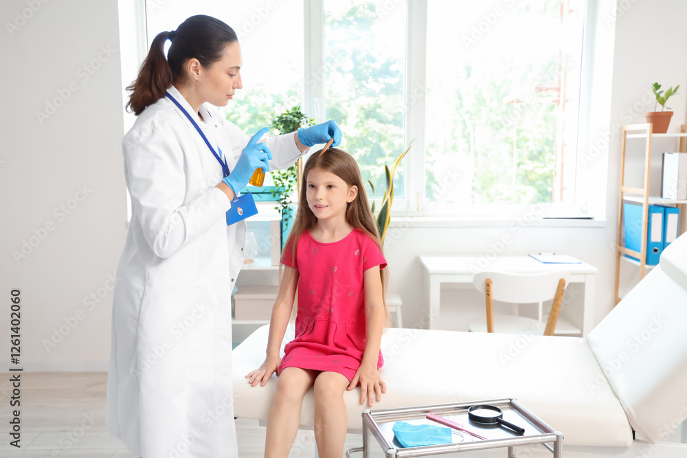 Female doctor spraying little girl's hair with pediculosis in clinic Female doctor spraying little girl's hair with pediculosis in clinic
