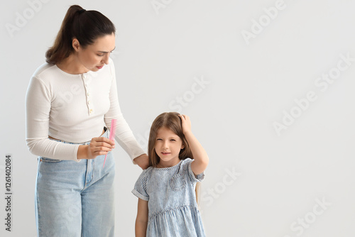 Little girl with pediculosi...
