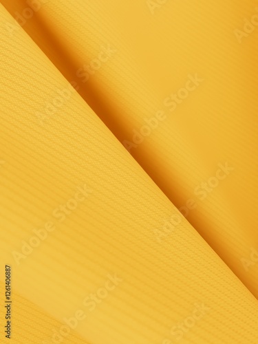 Macro shot capturing the textured surface of yellow viscose fabric, with a soft blur achieved through a shallow depth of field. photo