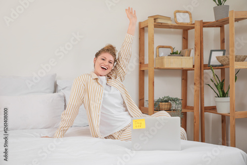 Happy young woman with lapt...