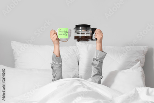 Woman holding cup with text...