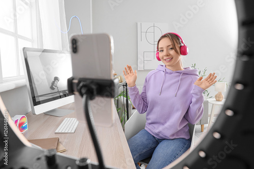 Female blogger in headphone...