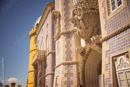 Ornate facade with Triton sculpture at Pena Palace, Sintra.