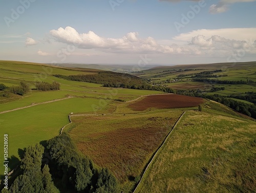 Aerial view of rural valley, farmland, and hills