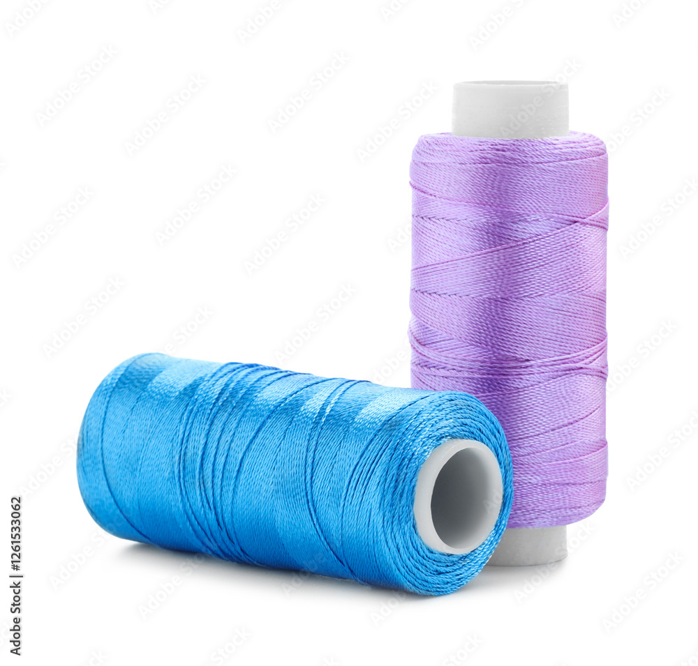 Spools of bright sewing threads isolated on white Spools of bright sewing threads isolated on white