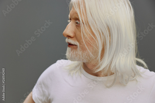 Photography elderly man with long white hair and beard, wearing a plain shirt, side profile