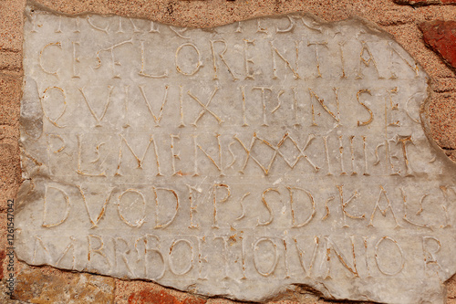 Historic artefacts in the entrance portico of the Basilica of Sant' Ambrogio, Milan photo