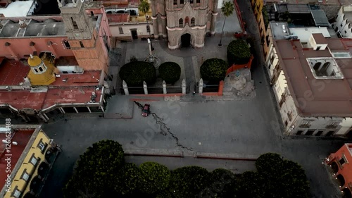 San Miguel de Allende - Gothic Church, the Parroquia de San Miguel Arcángel reveal 4k drone and aerial video at sunrise. Mexico Colonial town and pueblo magico