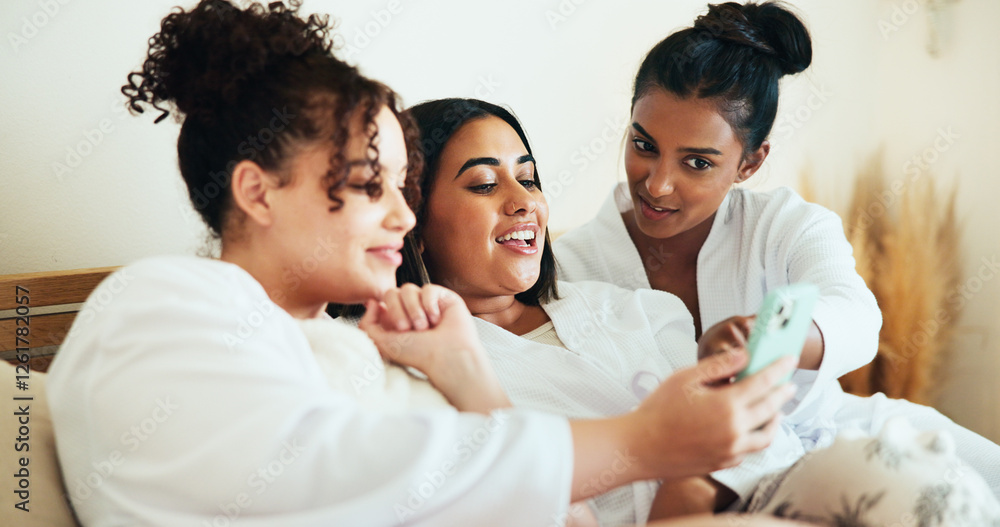 Fototapeta premium Girl, friends and phone in bedroom at spa with sharing, talk and relax with memory on vacation together. Women, group and happy with smartphone, mobile app and social media for bonding at resort