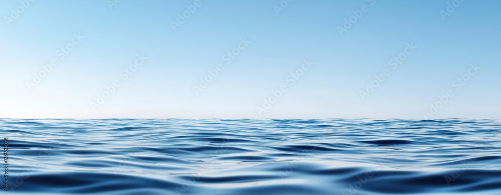 Calm blue ocean water with gentle waves under clear sky Calm blue ocean water with gentle waves under clear sky