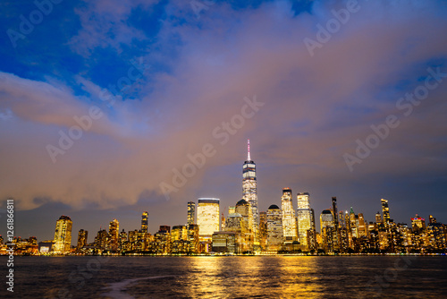 New York City skyline. NYC skyscrapers. Manhattan skyscrapers at dusk. NY cityscape with lights. Night in New York. NYC night cityscape. Downtown Manhattan. New York at twilight. American city.