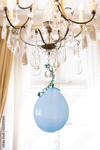 A balloon on a chandelier photo