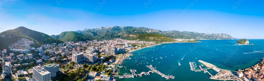 A drone camera panoramic view of Budva riviera and St. Nicholas Island, Montenegro A drone camera panoramic view of Budva riviera and St. Nicholas Island, Montenegro