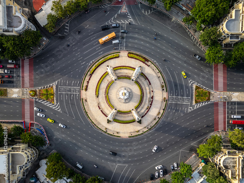 Aerial view of Democracy monument, a roundabout, with cars on busy street road in Bangkok Downtown skyline, urban city. Thailand. Landmark architecture landscape. photo