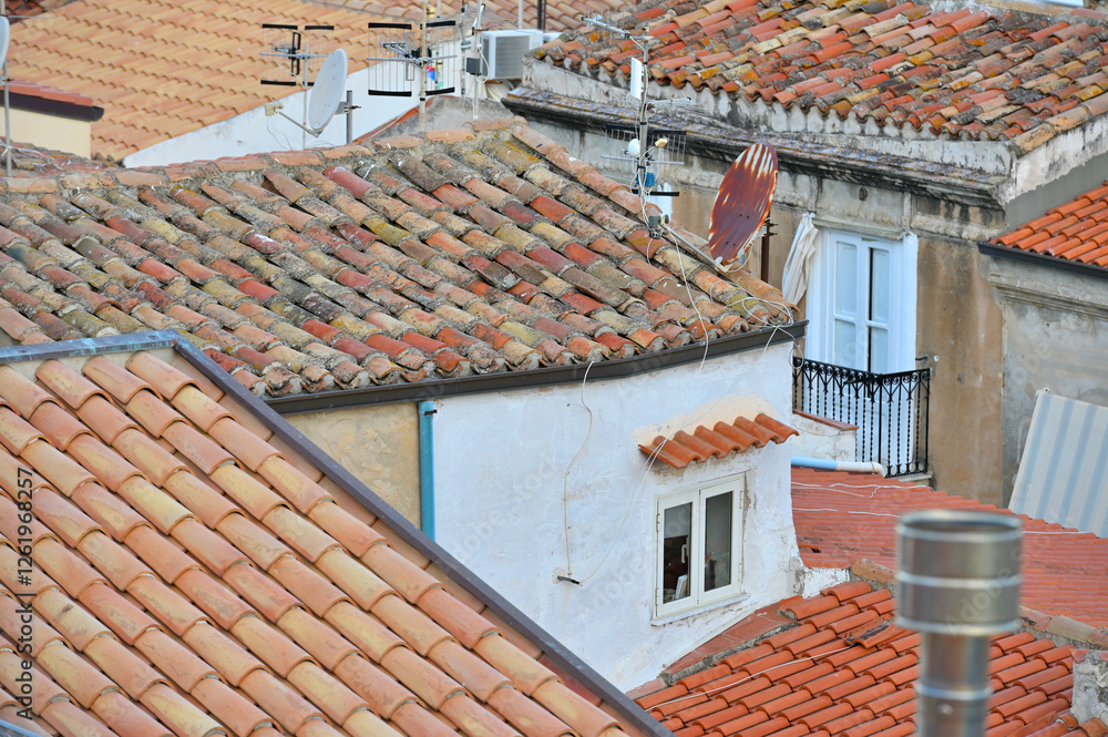 View on old red roofs in Cefalu city. SIcily island