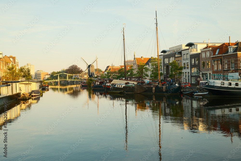 Scenic view of old dutch houses along the canal at sunrise Scenic view of old dutch houses along the canal at sunrise