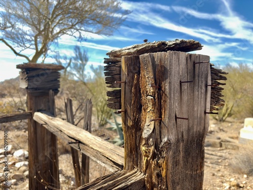 Weathered wooden grave enclosure in pioneer cemetery photo