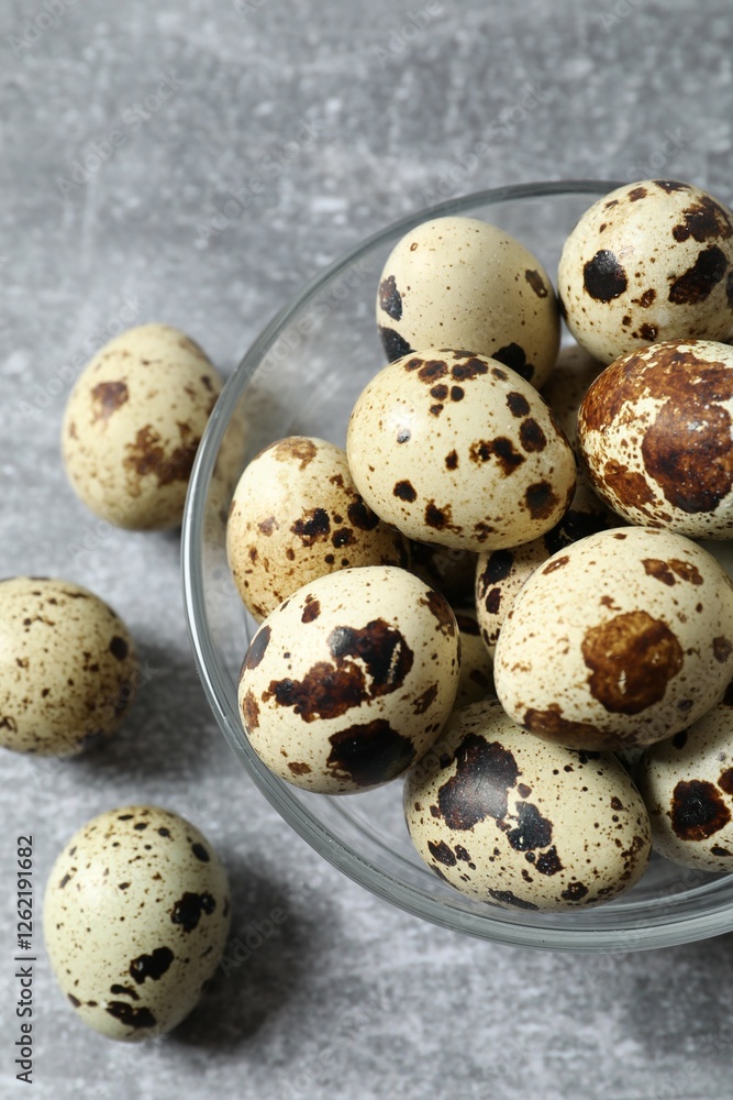 Quail eggs in a plate on gray background Quail eggs in a plate on gray background
