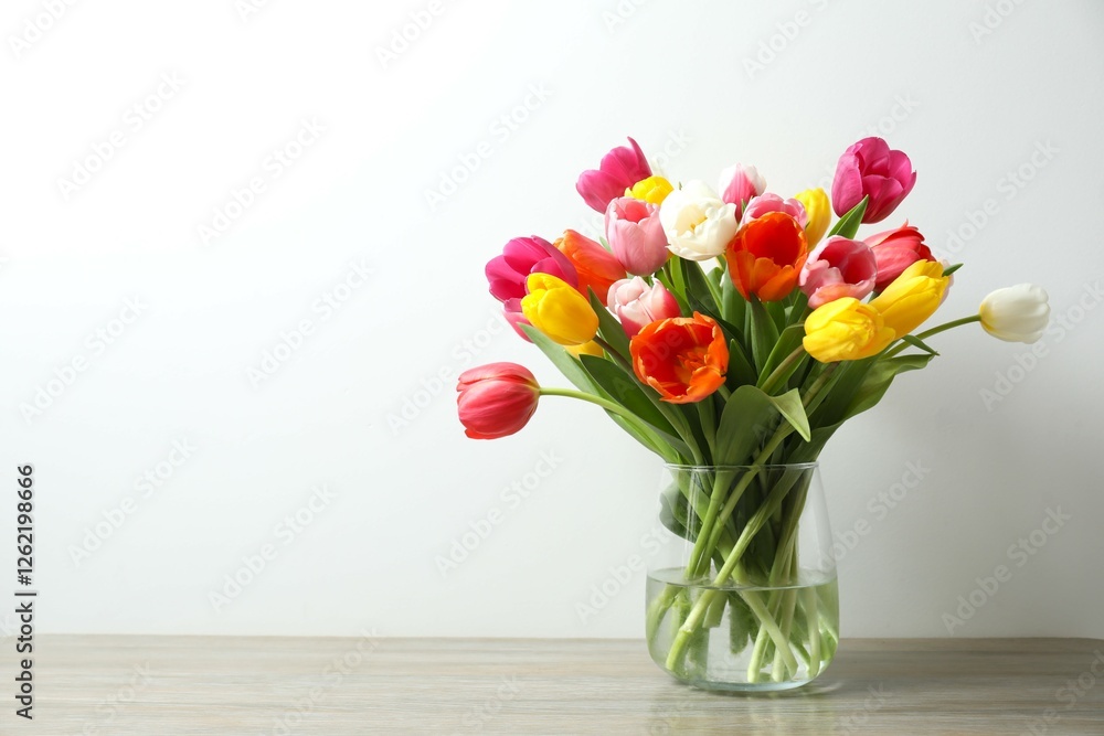 Fototapeta premium Beautiful fresh tulips in vase on the table
