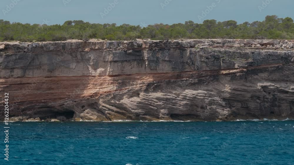 Explore the Stunning Coastal Cliffs and Crystal Clear Waters of Beautiful Ibiza, a Beautiful Island in Spain Explore the Stunning Coastal Cliffs and Crystal Clear Waters of Beautiful Ibiza, a Beautiful Island in Spain