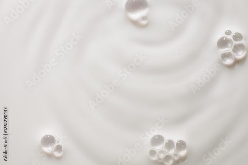 Cosmetic cream milk foam texture milky beige colored background