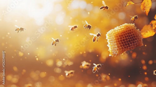 Honey bee gathers nectar while perched on a glistening honeycomb under warm g...