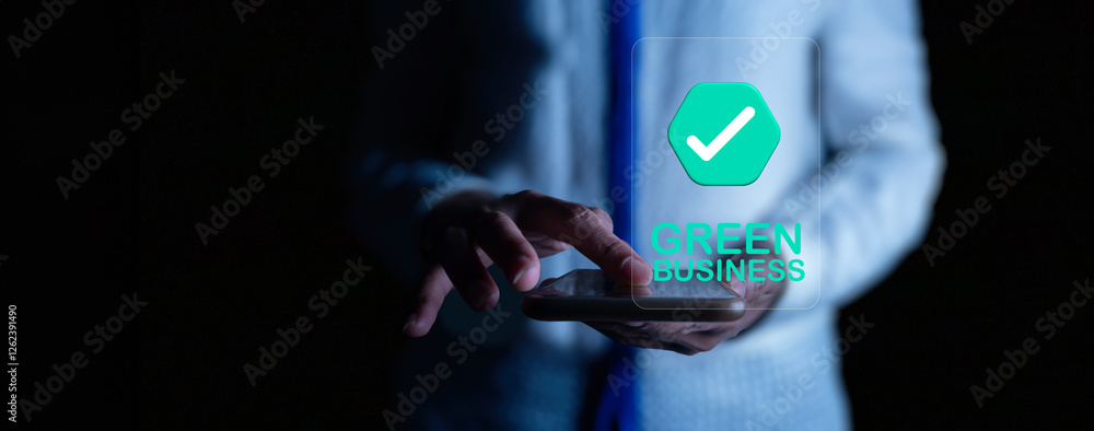 A businessman interacts with a holographic interface displaying a green business certification. The futuristic digital concept highlights sustainability and eco-friendly business practices.